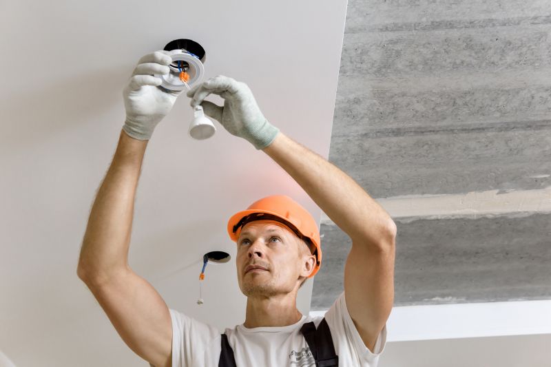 Electrician Installing a Light Fixture